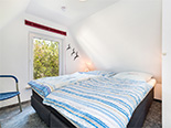 Ferienwohnungen von R&uuml;genHerz: Schlafzimmer Fischerh&uuml;tte